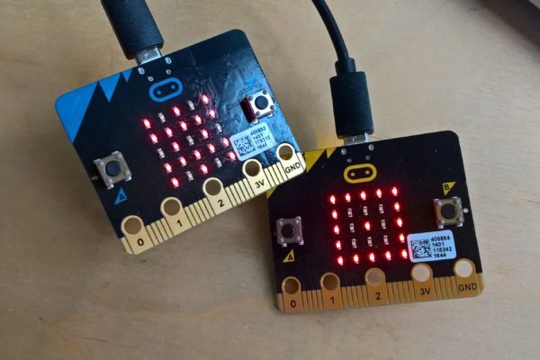 picture of Micro:bit circuit board with LEDs flashing
